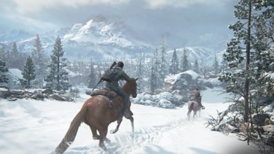 The Last of Us Part II Remastered screenshot showing Ellie and Dinah racing through a snowy landscape on horseback