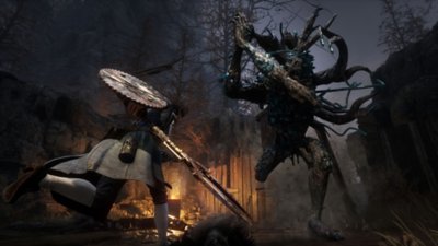 Skjermbilde fra Lies of P av Pinocchio som slåss mot en stor fiende