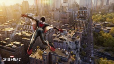 Spider-Man flies through the city on his web wings.