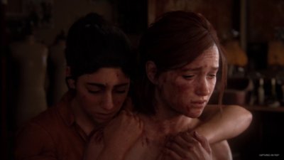 The Last of Us Part II Remastered screenshot showing Dinah hugging Ellie